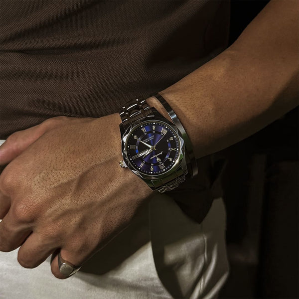 Close-up of the day and date complication on a black dial