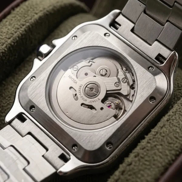 Santtus case back with exhibition window showing the automatic movement, on green suede