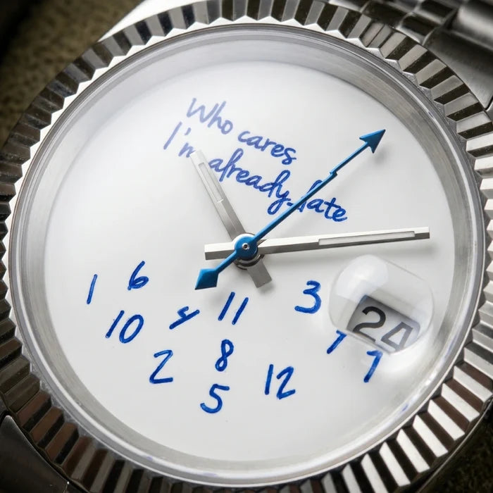 Sprezzatura automatic watch dial close-up, cobalt hand-script and scattered numerals