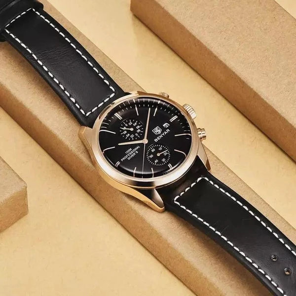 Livorno rose gold-tone watch with black dial resting on kraft paper blocks, styled flat lay