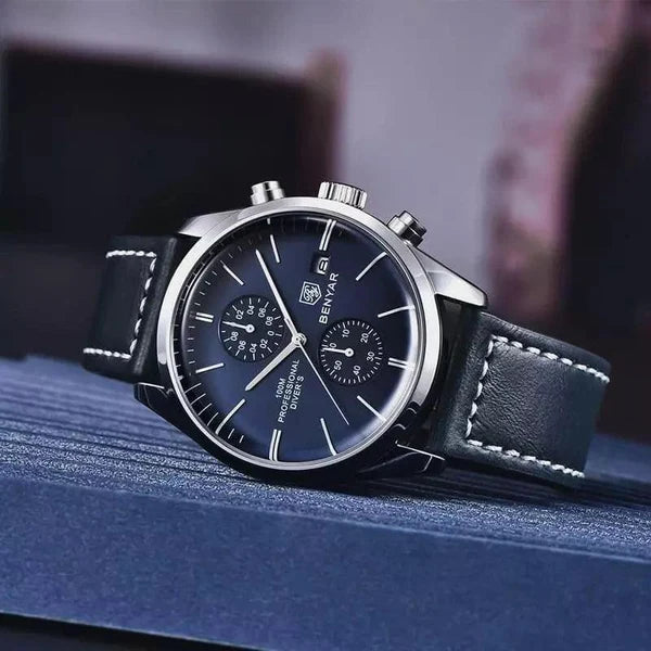 Livorno silver-tone watch with deep blue dial standing on a navy textured surface, styled close-up