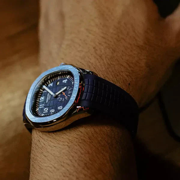 Portofino sport watch with blue dial and blue rubber strap worn on the wrist, side profile